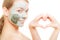 Skin care. Woman in clay mud mask on face. Beauty.