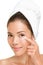 Skin care woman putting face cream