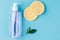 Skin cleanser with a sponge on a blue background. The concept of natural cosmetic