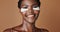Skincare, beauty and face of black woman in studio with glowing, natural and facial routine. Smile, cosmetic and