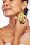 Skincare, beauty and senior woman with kiwi in studio isolated on a transparent png background. Food, fruit and natural