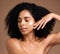 Skincare, black woman and cream for face detox, organic facial and on brown studio background. African American female