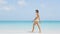 Skincare and body care woman beauty walking on beach
