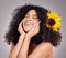 Skincare, cheerful or black woman with flowers in hair in studio for spring time, luxury spa or self care. Aesthetic
