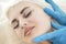 Skincare Concept. Woman During Facial Beauty Treatment While Preparing for Pigmentation Removal by Using Facial Pencil Markup at