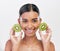 Skincare, health and portrait of a woman with kiwi for nutrition, diet and wellness. Happy, spa treatment and an Indian