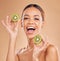 Skincare, kiwi and portrait of woman with smile in studio for wellness, facial treatment and natural cosmetics. Beauty