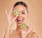 Skincare, kiwi and portrait of woman with smile in studio for wellness, organic facial and natural cosmetics. Beauty