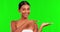 Skincare, product and a woman pointing on a green screen background in studio for natural treatment. Portrait, beauty