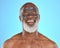 Skincare, water and black man with mask for facial on blue background in studio for wellness, spa and cleanse