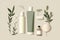 Skinimalism or skin minimalism concept. Set of cosmetic products and green leaves. Different containers for cosmetic advertising.