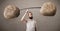 Skinny guy lifting large rock stone weights