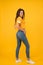 Skinny jeans suits her. Self confidence is best outfit. Sexy girl yellow background. Sexi girl. Sensual girl in casual