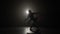 Skinny silhouette of a ballerina doing a graceful reverence in slow motion -