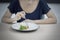 Skinny woman eating small portion salad