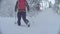 Skitour in Siberia. Man`s legs skiing in a snowy forest.