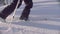 Skitour in Siberia. Man`s legs skiing in a snowy forest.