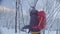 Skitour in Siberia. A man skiing in a snowy forest.