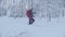 Skitour in Siberia. A man skiing in a snowy forest.