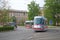 Skoda modern tram turns on a city street, Brno