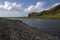 Skoga river and volcanic formation and outwash scenery near Skogafoss waterfall in Iceland