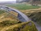 Skogafoss waterfall in Iceland river behind waterfall during heavy rainfall seen from above