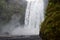 Skogafoss Waterfall and Moss Colored Cliffs