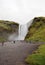 Skogafoss waterfall and tourists in the summer, Iceland