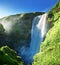 Skogarfoss waterfall and summer sunny day