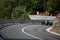 Skradin Croatia, June 2020 Green and black formula racecar seen from distance going uphill during a race championship