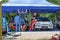 Skradin Croatia June 2020 Multiple people standing in a race car paddock with two cars, prepairing the cars for the hill climb