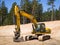 Skrunda, Latvia - May 3, 2022: Yellow excavator JCB JS 220 LC is located in a quarry