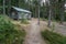 Skuleskogen, Sweden - 08.22.2021: Wooden cabin in the forest of Skuleskogen national park in Sweden with pile of birch