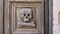 skull decoration detail on wooden door