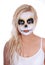 Skull makeup on blonde young girl