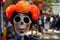 Skull painted and decorated with orange paper mache flowers and earrings/decorated skull for Dia de los Muertos, Day of the Dead