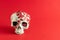 Skull with small red hearts. Minimal romantic love concept. Halloween creative background. Copy Space