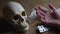 Skull, tablets and hand of a dead person