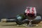 Skulls in the blood glass and wine on wooden table