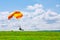 Skutech, Czech Republic, 6 August 2020: Landing of a parachutist on a grassy field. Skydiving