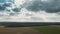 Sky Above Empty Countryside Rural Field Landscape In Spring Cloudy Day. Agricultural Field. Aerial View. Drone Lapse