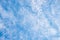 Sky background with fleecy Cirrostratus clouds overcast