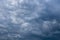 Sky background with gray cumulus clouds