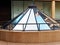 Sky and Building Reflections in Conical Glass Atrium