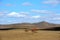 Sky and cloud above field and hills