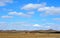 Sky and cloud above field and hills