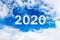 Sky cloud year 2020. Happy New year concept. 2020 cloud against the blue sky.Year 2020 symbol inscription on a background of blue