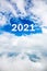 Sky cloud year 2021. Happy New year concept. 2021 cloud against the blue sky.Year 2021 symbol inscription on a background of blue