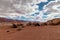 The sky and the clouds add beauty to the boulders and the mountain range, Vermillion cliff range, Page, AZ, USA