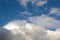 Sky clouds background. Large, big fluffy cumulus cloud. Soft focus, copy space